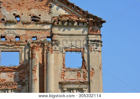 Ruins Of Ancient Palace In Pruzhany, Belarus Made Of Red Brick With The Blue Sky Instead Of Windows.