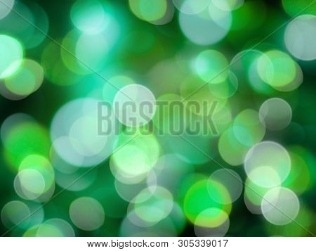 Greensand White Glowing Round Blurred Lights On A Black Background Abstract