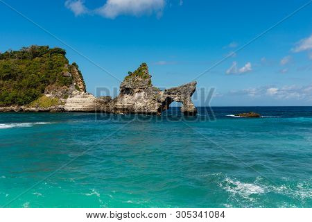 View Of Tropical Beach, Sea Rocks And Turquoise Ocean, Blue Sky. Atuh Beach, Nusa Penida, Indonesia