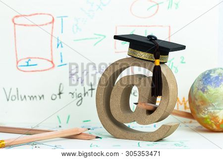 Email Address Symbol And Graduation Cap On Formula Arithmetic Equation Background Near Globe Pencils