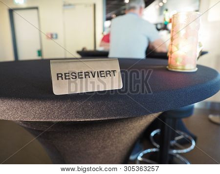 Reserviert (meaning Reserved In German) Sign On A Restaurant Table
