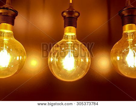 Closeup And Crop Decorate Electric Light Bubs And Switch On To Yellow Lights Glowing On Refection Li