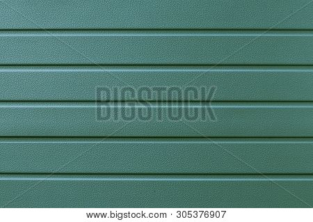 Reflecting Metal Convex Texture In Lines. Green Metallic Ribbed Surface. Abstract Pattern. Metal Shu