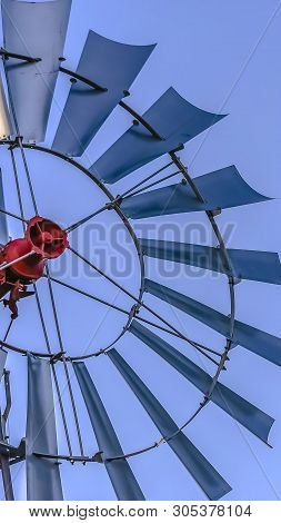 Panorama Frame Close Up Of The Multiple Blades Of A Windpump With Clear Blue Sky Background