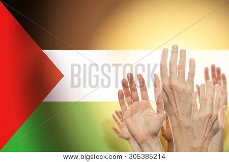 People Raising Hands And  Flag Palestina On Background. Patriotic Concept