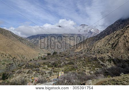 Landscape Of The High Atlas Mountains Among Clouds And Snowfall. Morocco