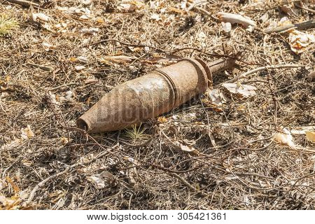 Old Rusty Unexploded Ordnance Of Wartime Times In The Forest