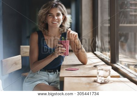 Attractive Sociable Friendly-looking Alluring Blond Woman Short Hairstyle Drink Tasty Smoothie Lean 
