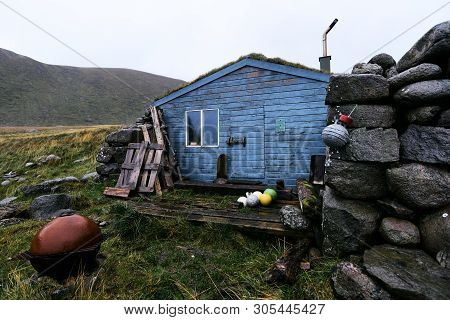 Blue Wooden Scandinavian Fishing And Hiking Cabin On Lofoten Islands In Norway (stokkvika)