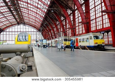 Antwerp, Belgium, May 2019,  Group Of People Walking To Board Train At Antwerp Central Station, Belg