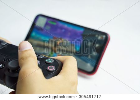 Bishkek, Kyrgyzstan - June 06, 2019: Man Playing Games On Apple Arcade Subscription System On Ios 13