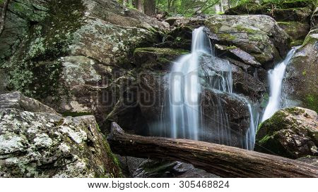 Waterfall With Swimming Hole Along Hiking Trail During Vacation Travel