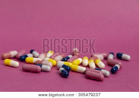 Various Colored Medical Capsules With White Microgranules