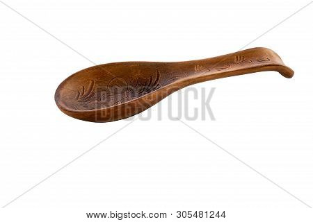Object One Large Red Ceramic Spoon Is Presented On A White Background. Large Clay Spoon With Rest Or
