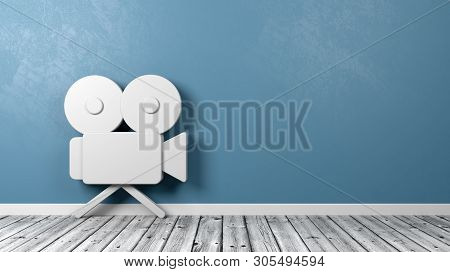 White Old Video Camera 3d Symbol Shape On Wooden Floor Against Blue Wall With Copy Space 3d Illustra