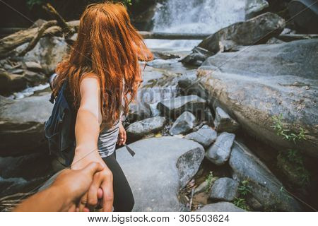 Male And Woman Couples Asia. Walking Hand Travelers Travel Nature Forests, Mountains, Waterfalls. Tr