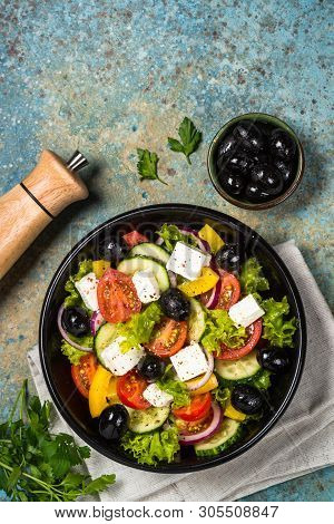 Greek Salad. Vegetable Salad From Tomato, Cucumber, Feta Cheese And Olive Oil. Mediterranean Kitchen