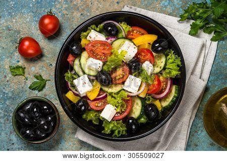 Greek Salad. Vegetable Salad From Tomato, Cucumber, Feta Cheese And Olive Oil. Mediterranean Kitchen