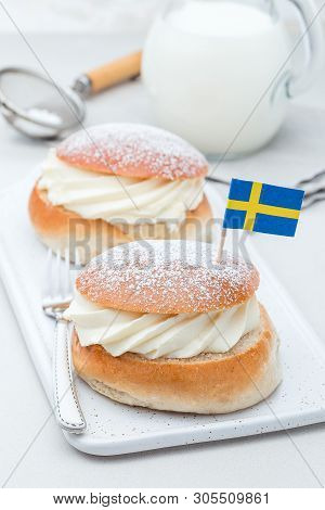 Traditional Swedish Dessert Semla, Also Called Shrove Bun, With Almond Paste And Whipped Cream Filli