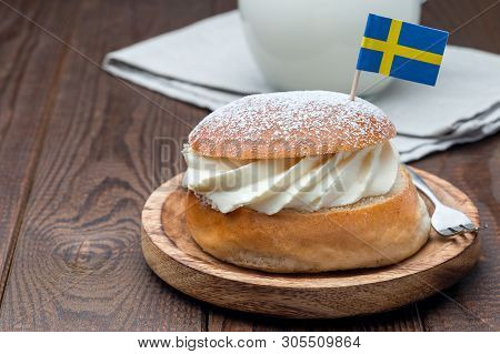 Traditional Swedish Dessert Semla, Also Called Shrove Bun, With Almond Paste And Whipped Cream Filli