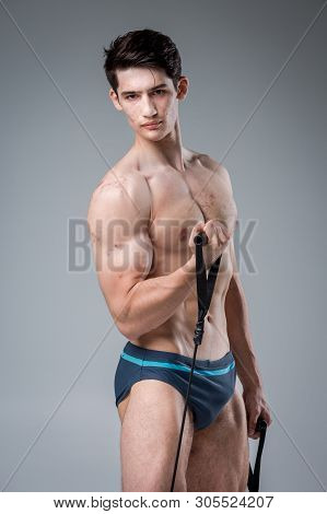 Studio Portrait Young Caucasian Man On Gray Background Posing. Theme Of Puberty, Problem Skin, Teen 