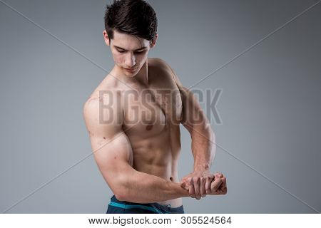 Studio Portrait Young Caucasian Man On Gray Background Posing. Theme Of Puberty, Problem Skin, Teen 