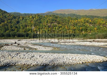 Panorama Of A Mountain River With Stones, Water And Wild Forest In Cherek Gorge In The Mountains Of 