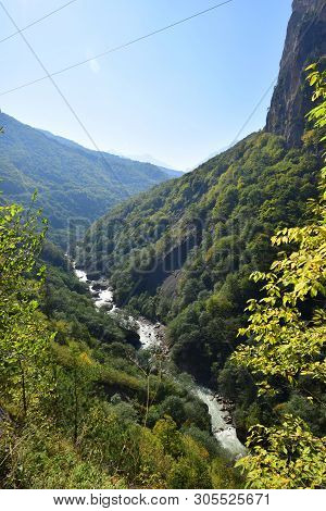 View Of A Mountain River In A Gorge With Stones And Mountains With A Forest In Cherek Gorge In The M