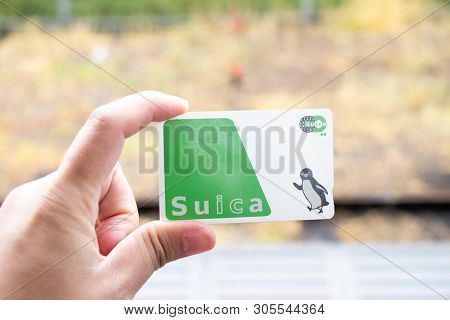 Tokyo, Japan - April 30, 2019 : Man Hold Suica Pass With The Blurred Background, Suica Is A Prepaid 