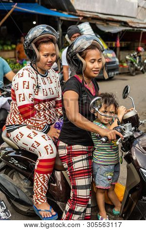 Makassar, Sulawesi, Indonesia - February 28, 2019: Terong Street Market. Closeup Of Three Females On