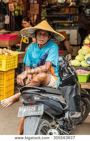 Makassar, Sulawesi, Indonesia - February 28, 2019: Terong Street Market. Older Man In Light Blue Shi