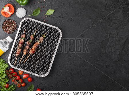 Grilled Pork Kebab With Paprika On Disposable Coal Bbq Grill With Fresh Vegetables On Blackbackgroun