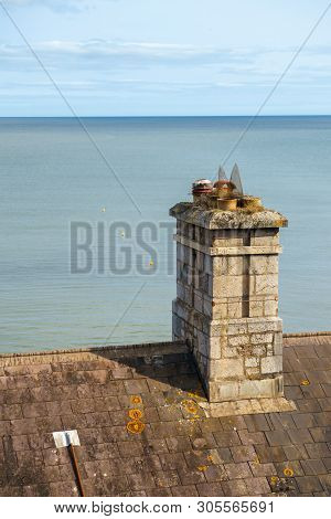 Vintage Chimney Pots By The Blue Sea