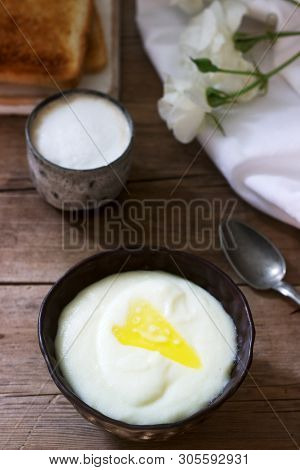 Homemade Breakfast Of Semolina Porridge, Coffee With Milk And Toast On A Wooden Background. Rustic S