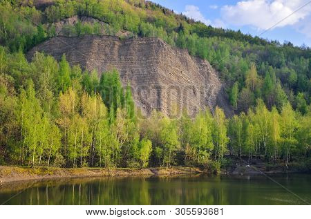 Beautiful Spring Mountain Landscape. Quarry In The Mountains By The Lake.