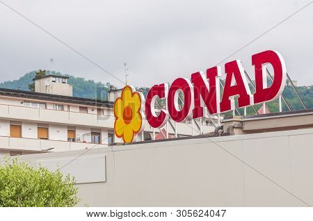 Carrara, Italy - June 10, 2019 - The Sign Of The Italian Chain Of Supermarkets Conad