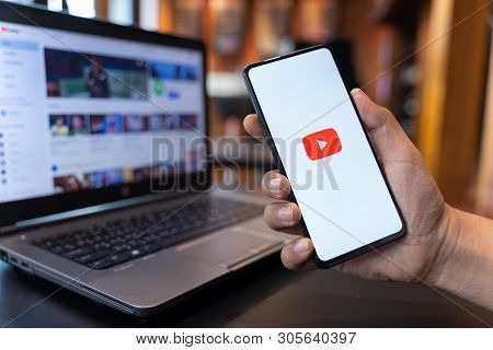 Chiang Mai, Thailand - May.01,2019: Man Holding Xiaomi Mi Mix 3 With Youtube Apps On Screen. Youtube