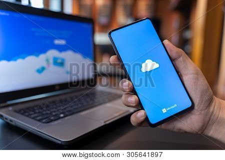 Chiang Mai, Thailand - May.01,2019: Man Holding Xiaomi Mi Mix 3 With Onedrive On Screen. Microsoft O