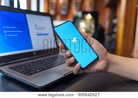 Chiang Mai, Thailand - May.01,2019: Man Holding Xiaomi Mi Mix 3 With Twitter App On The Screen.twitt
