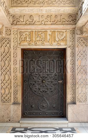 Cairo, Egypt- October 6 2017: Closed Wooden Aged Door With Ornate Bronzed Floral Patterns At The Pub