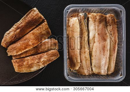 Marinated Fillet Mackerel Or Fillet Herring Fish With Spices Packed In Box On Plate Over Slate Stone