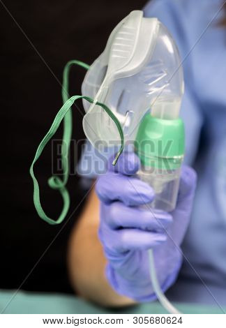 Nurse Prepares Oxygen Mask In Hospital, Conceptual Image