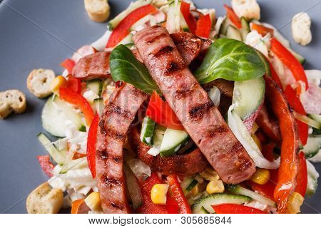 Salad With Grilled Sausage Paprica Cucumber And Croutons
