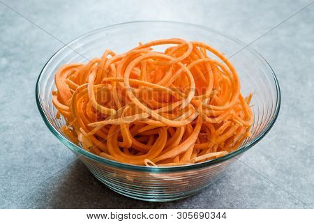 Spiralized Raw Sweet Potato In Glass Bowl Ready To Cook / Use.