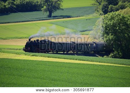 Steam Locomotive On The Way On The Strohgaeubahn Near Weissach In The Heckengaeu