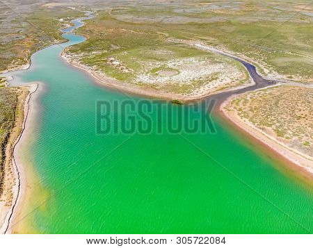 Amazing Aerial View Of Small Red Water River And Green Water Lake In Baskunchak