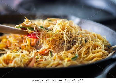 Process Of Cooking Of Sweet And Crunchy Stir Fry With Beansprouts And Noodles In The Wok, Macro Imag