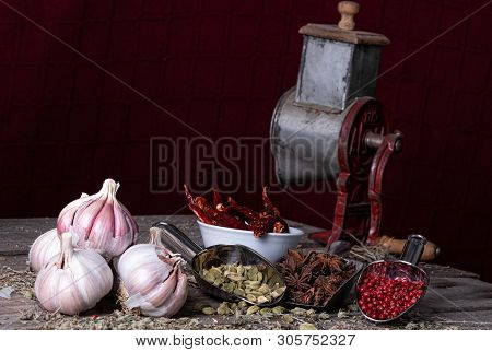 Variety Of Spices And Herbs On The Kitchen Table