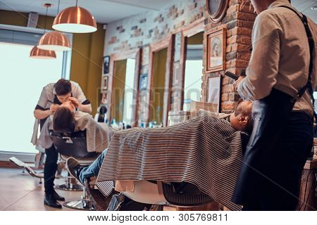 Attractive Brutal Man Just Got Good Beardcare From Talanted Trendy Barber.