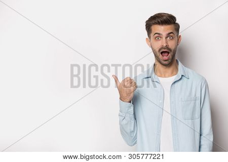 Guy Opened Mouth Gawp At Camera Pointing Finger At Copyspace
